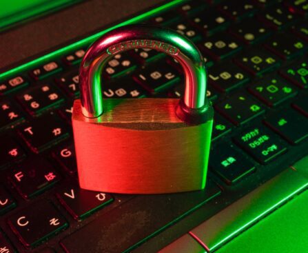 red padlock on black computer keyboard