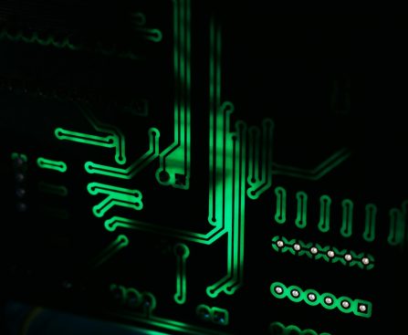 a close up of a computer motherboard in the dark