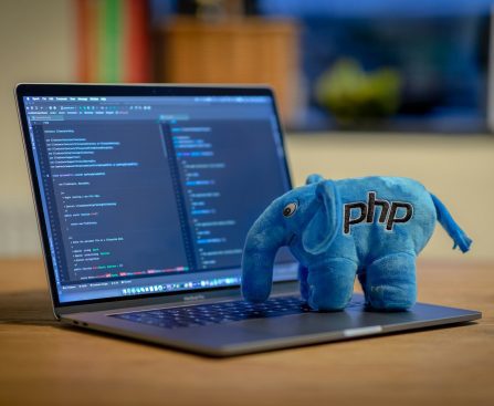 blue and white elephant plush toy on black laptop computer